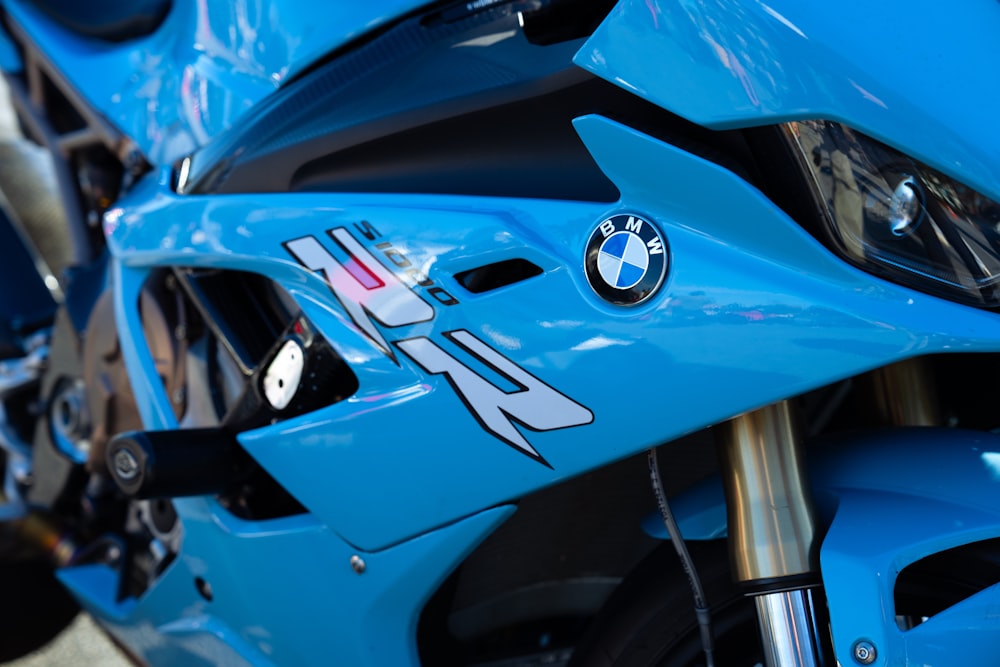 a close up of the front of a blue motorcycle
