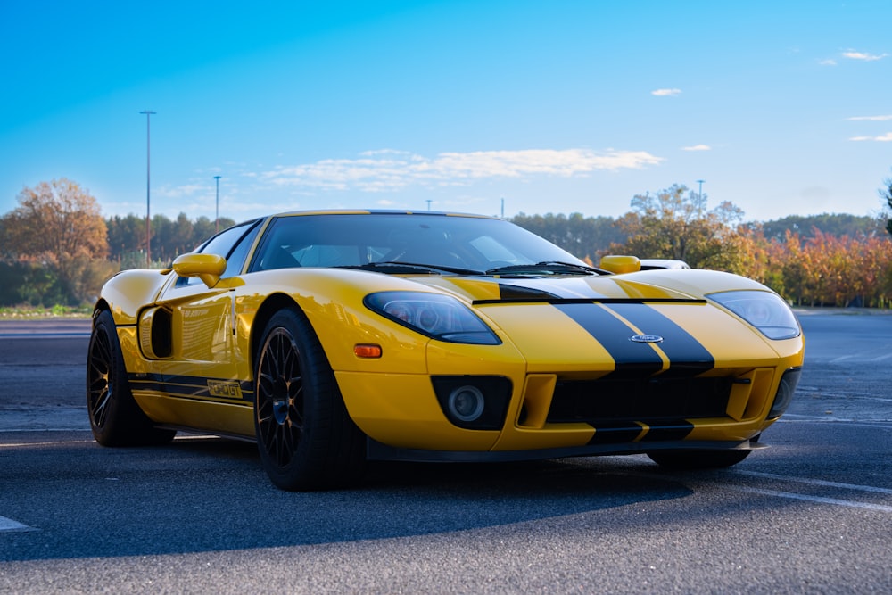 a yellow sports car parked in a parking lot