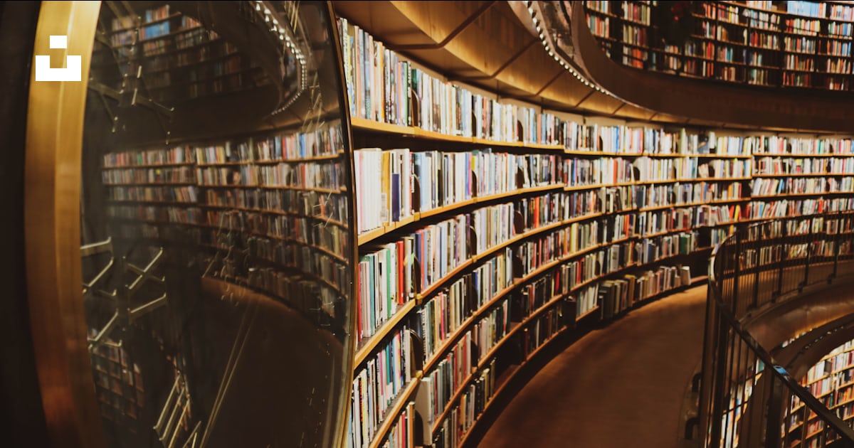 A large library filled with lots of books photo – Free Library Image on ...