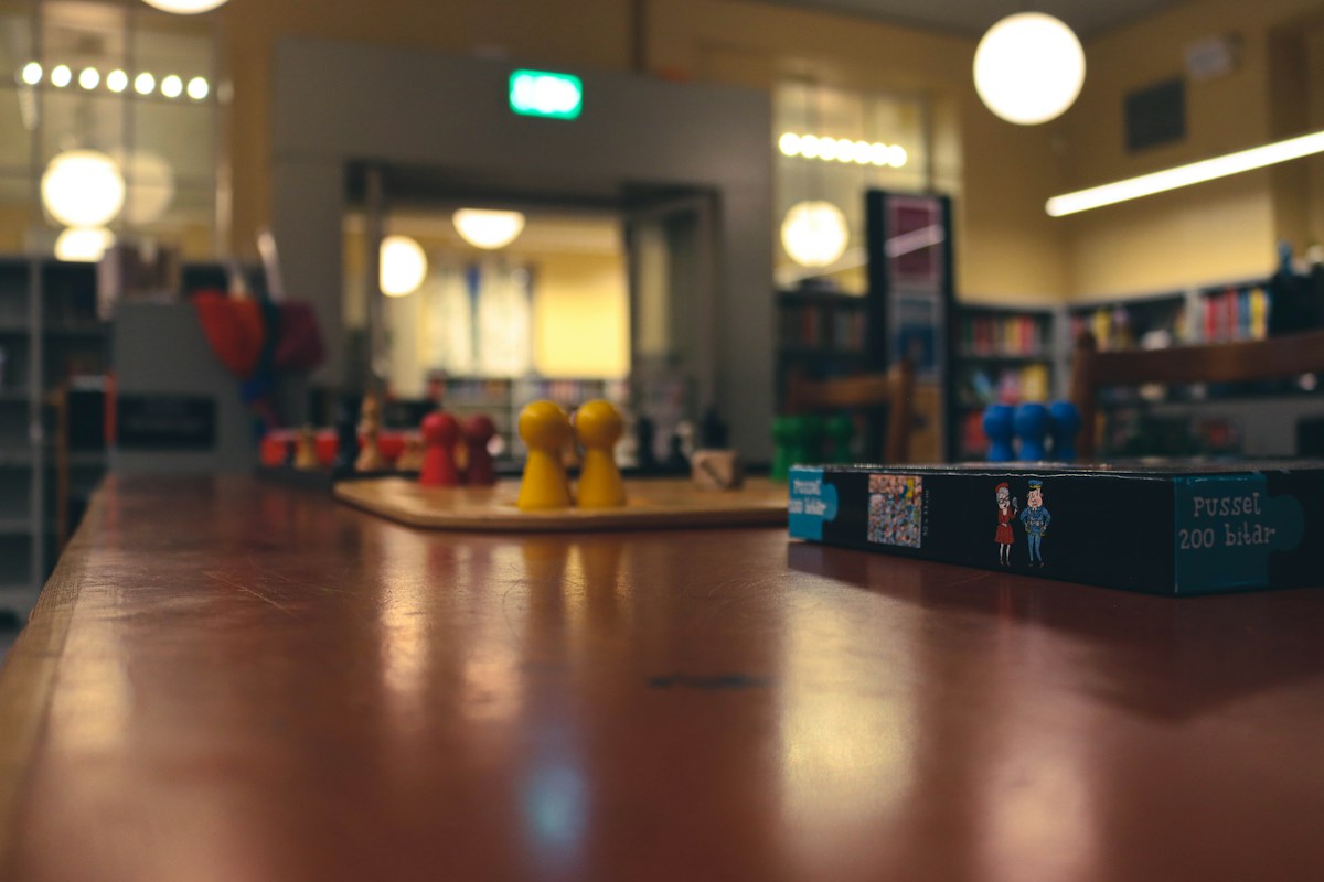 A book open on a library table, symbolizing organized planning for scout troop volunteer coordination.