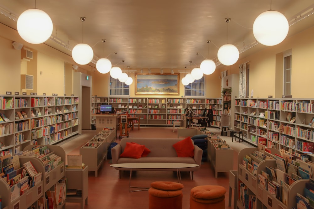 a library filled with lots of books and furniture