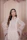 Close-up of a confident woman in a stylish Farha Collections ethnic outfit against a soft neutral backdrop.