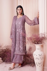 A modest young woman wearing a stylish dress, reflecting elegance and comfort.