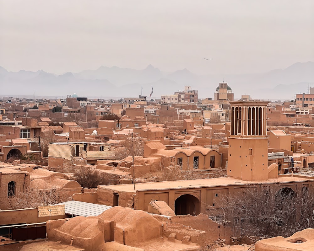 a view of a city with a tower in the middle of it