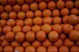 Juicy oranges stacked neatly, showcasing the quality of Edem Foods Ltd imports.