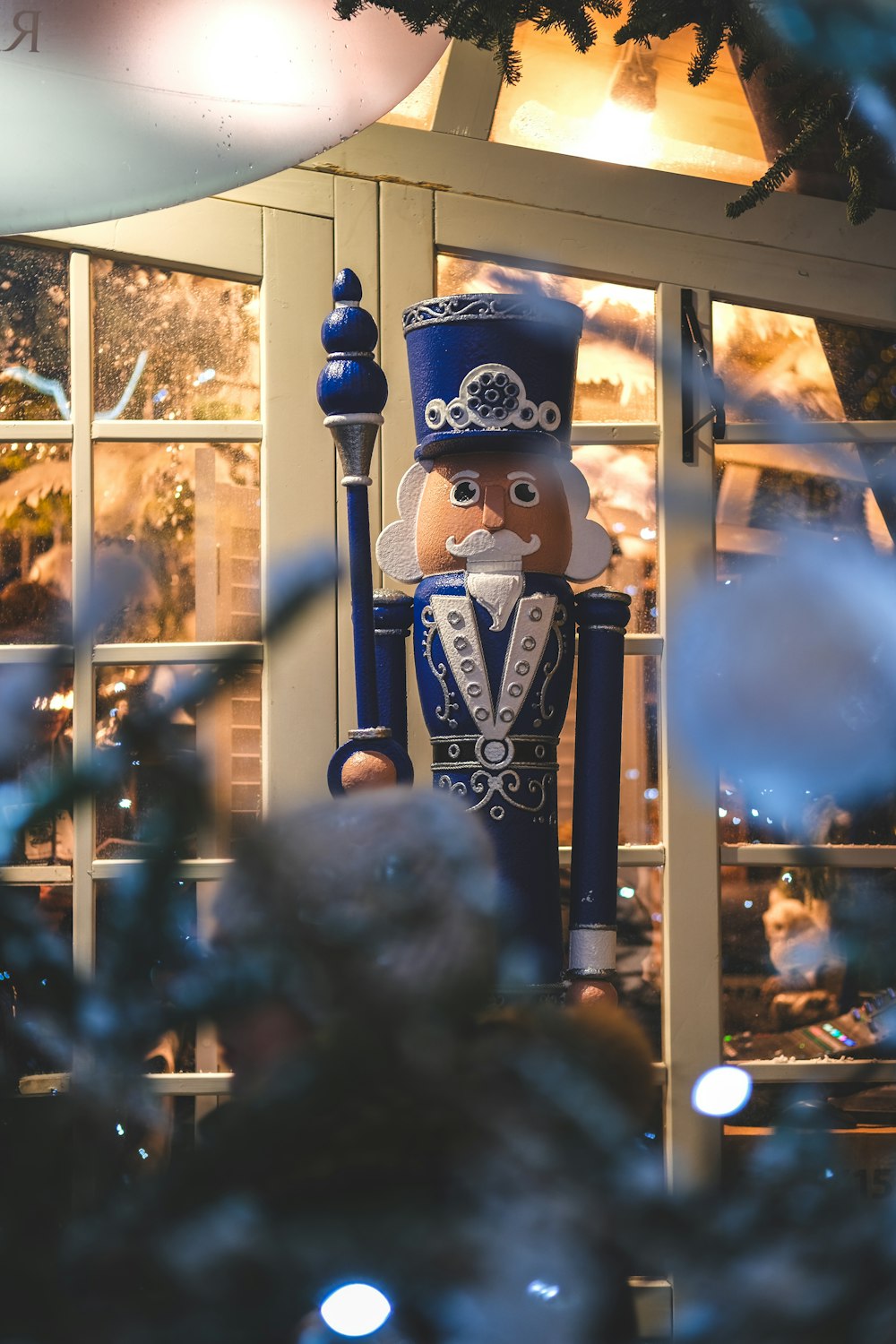 a nutcracker is standing in front of a window