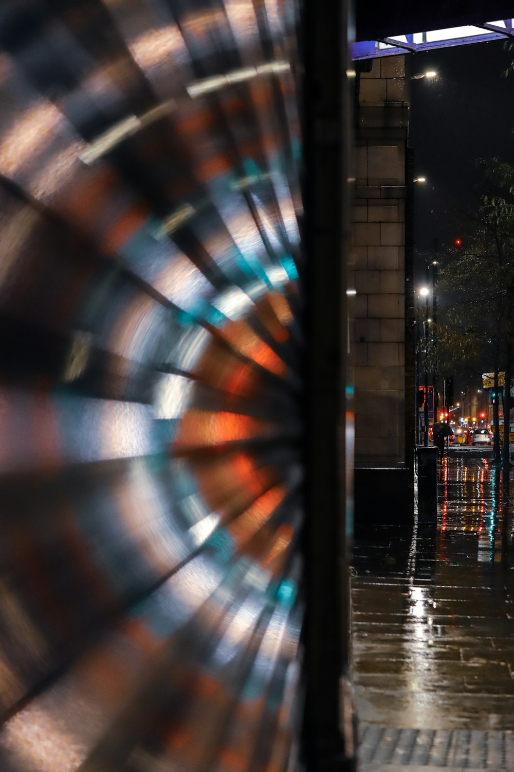 a street scene with focus on an umbrella