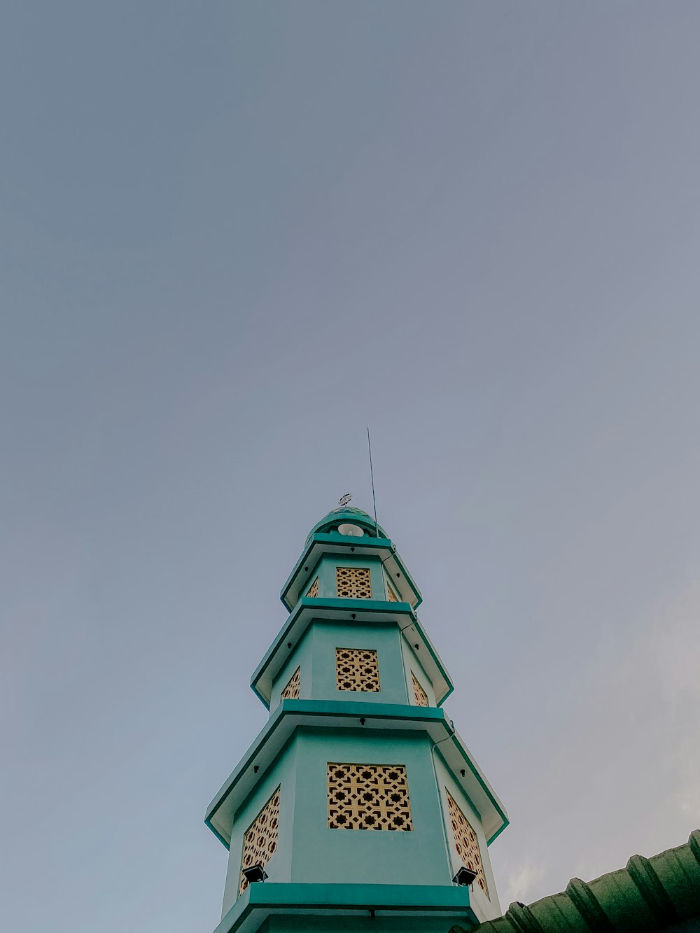 a tall tower with a clock on the top of it