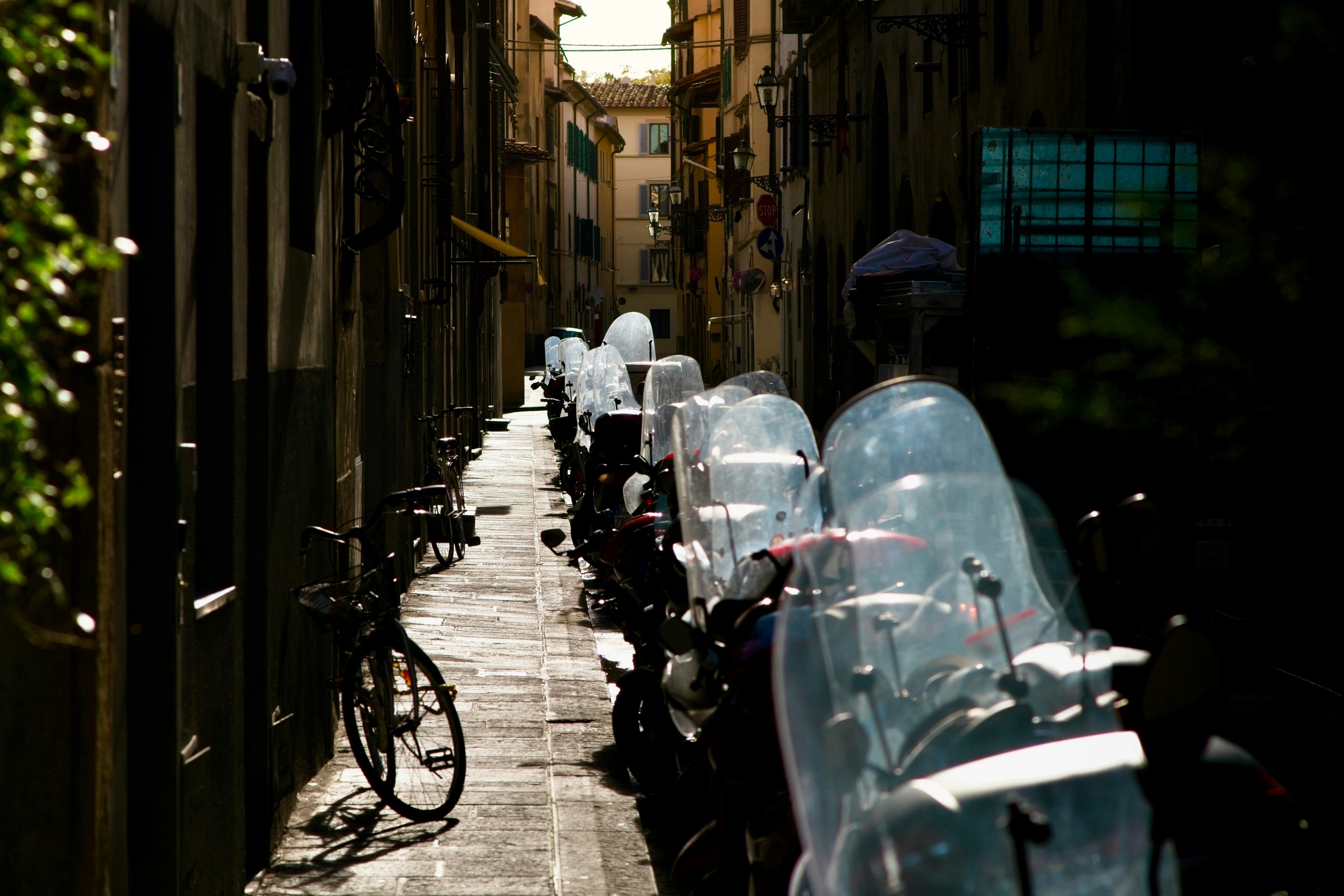 A row of parked bikes sitting next to each other