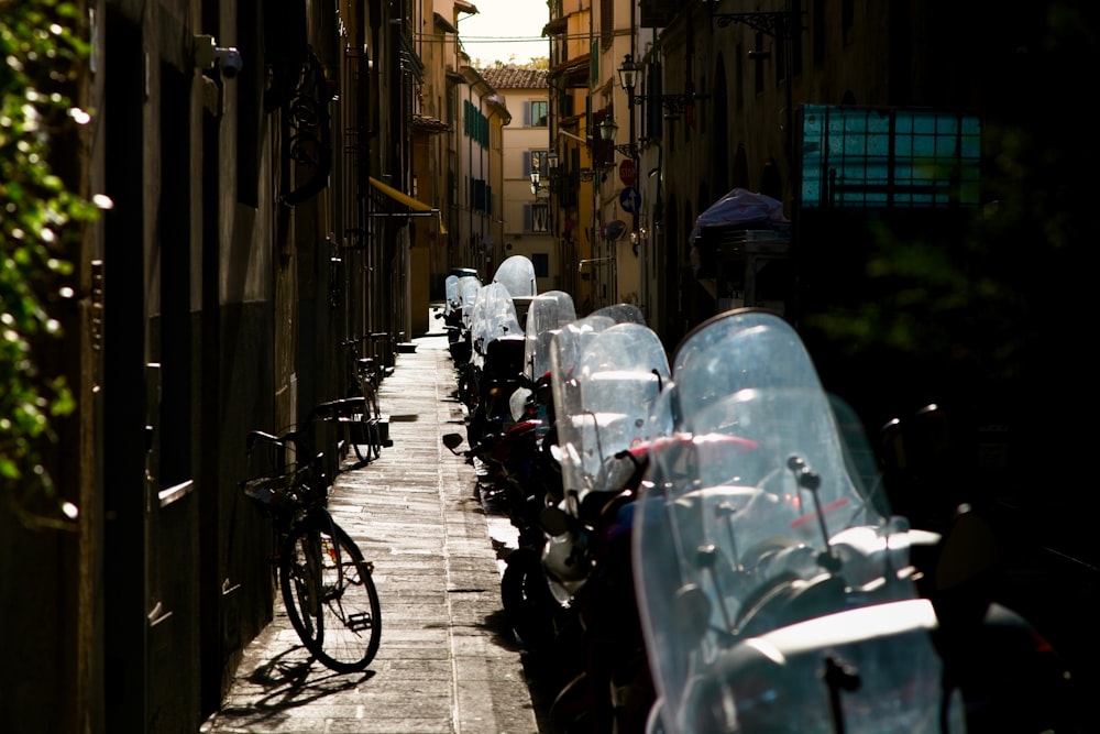 a row of parked bikes sitting next to each other