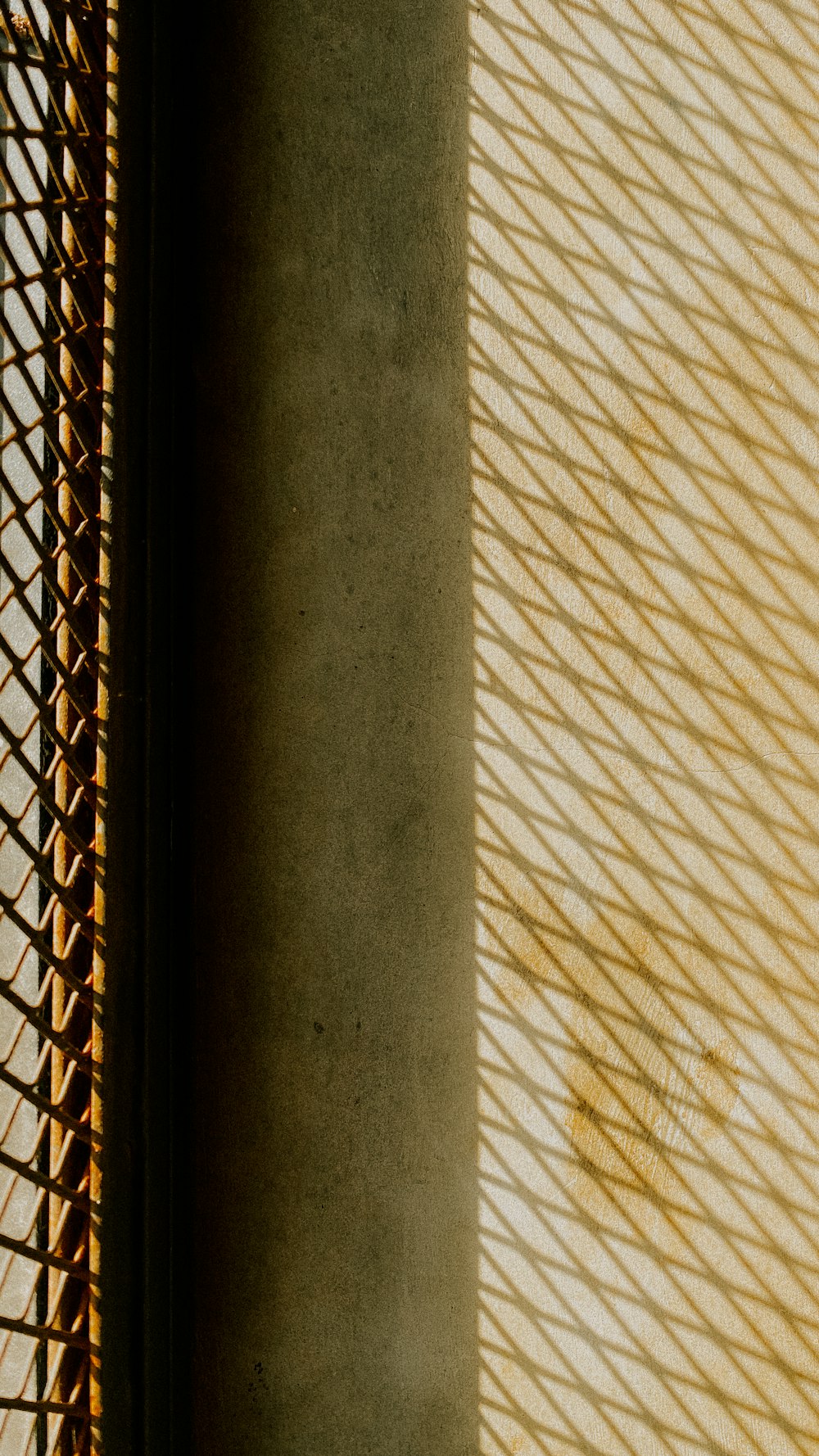 a clock sitting on the side of a wall next to a window