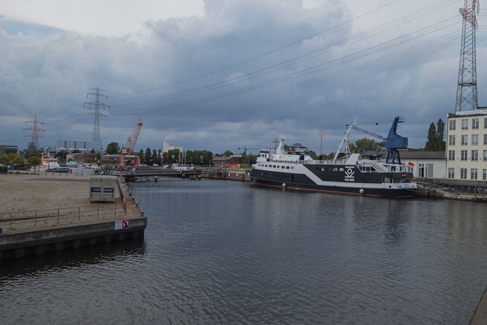 a large boat is docked at a dock