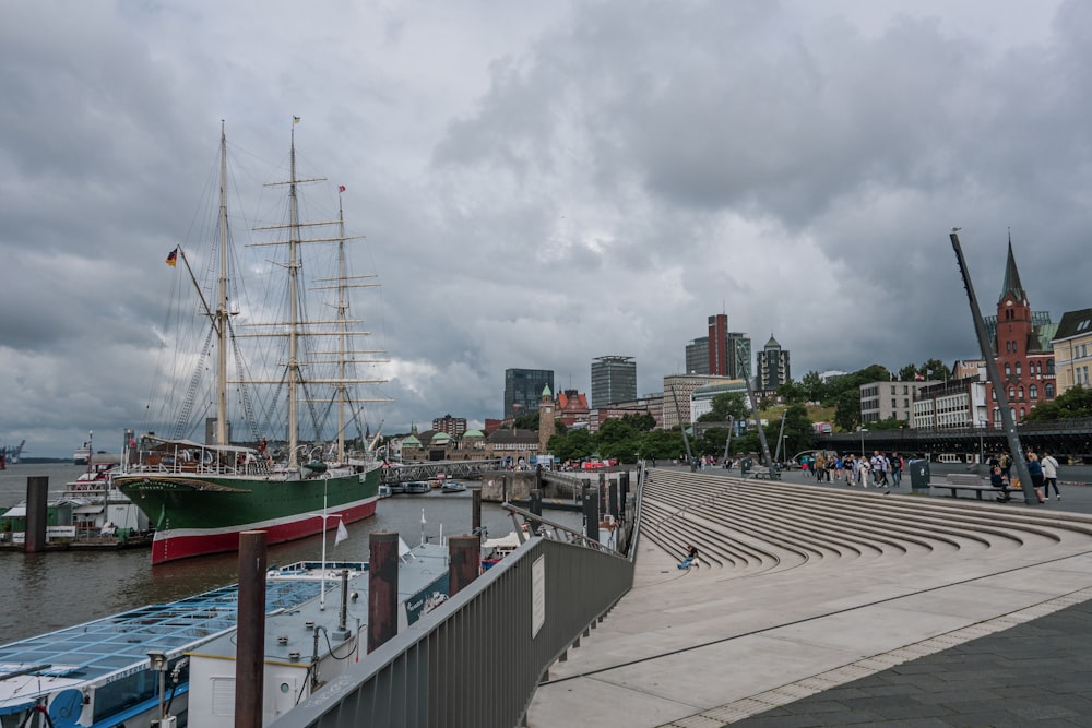 a large boat is docked at a pier