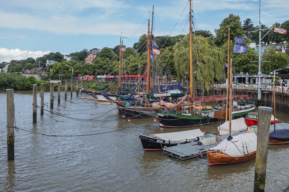 a group of boats that are sitting in the water