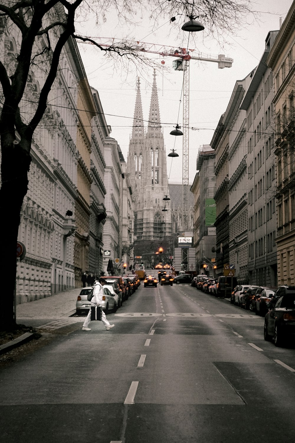 a city street with cars parked on both sides