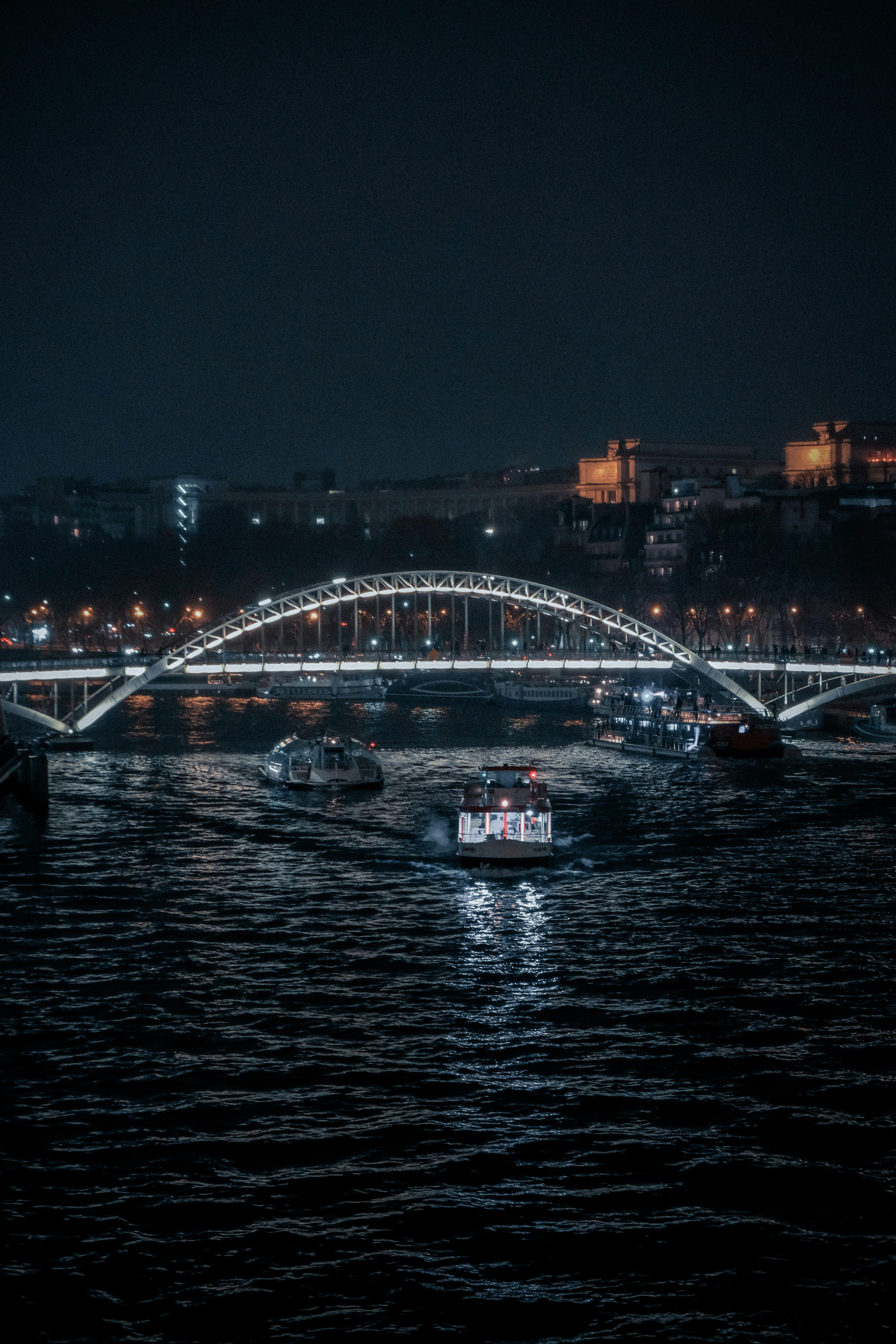 A bridge over a body of water at night photo – Free Travel Image on ...