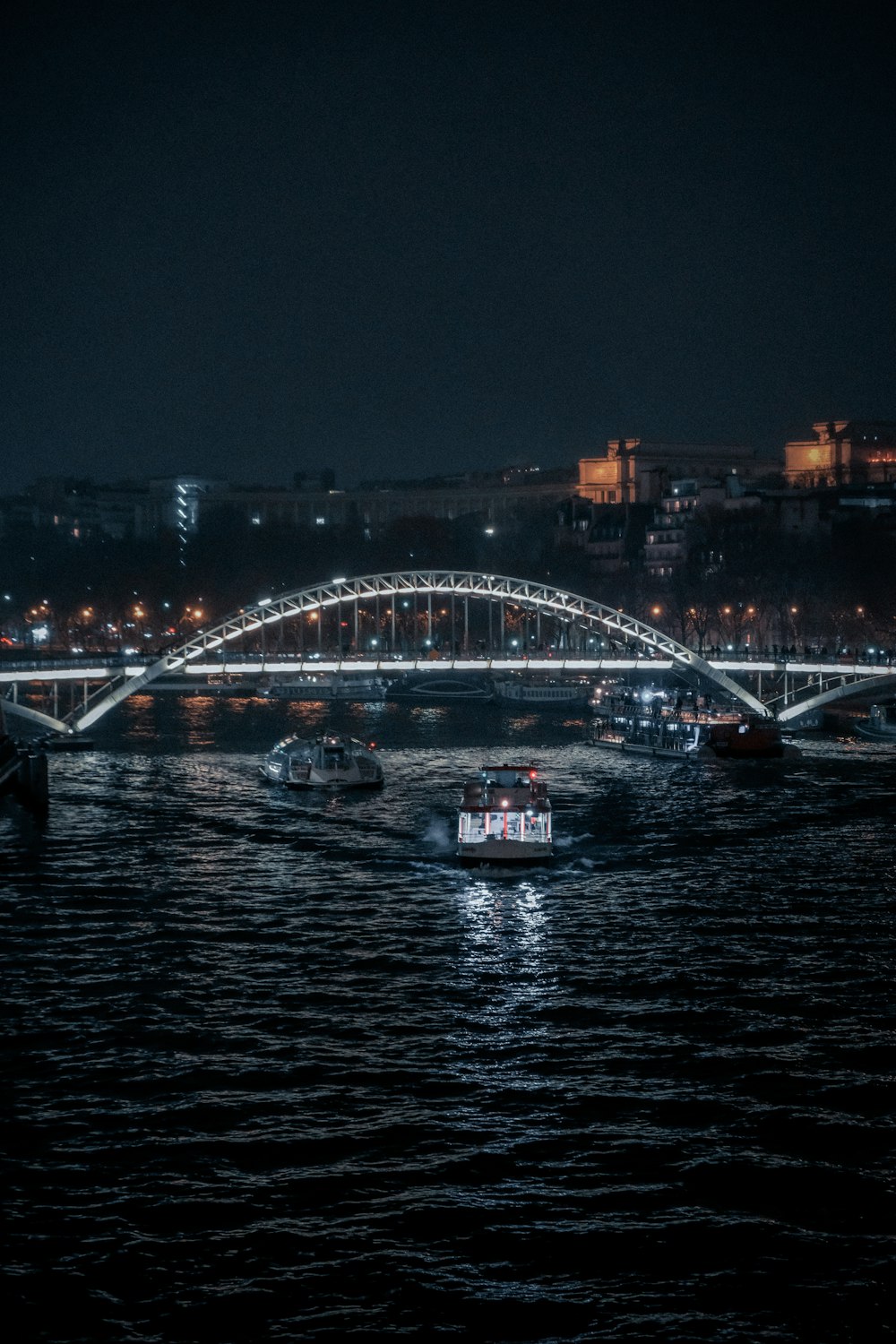 a bridge over a body of water at night