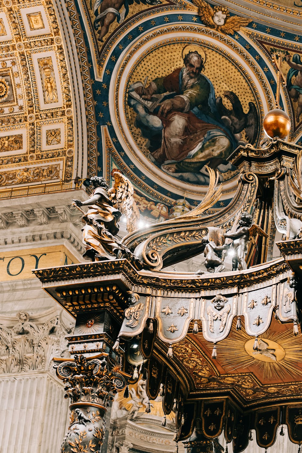 the ceiling of a building with a painting on it