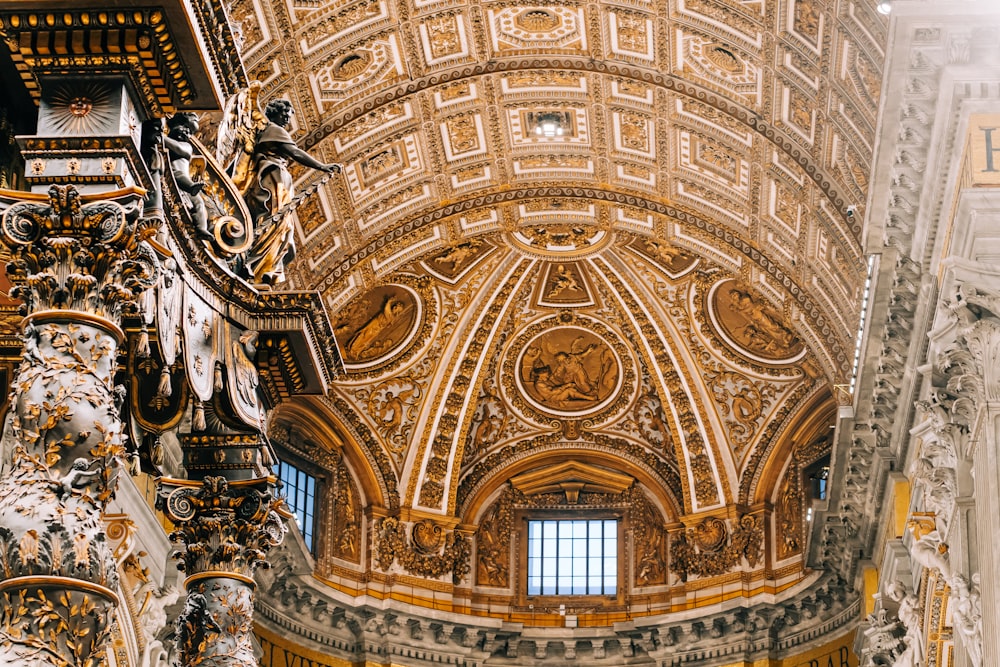 the ceiling of a building with a clock on it