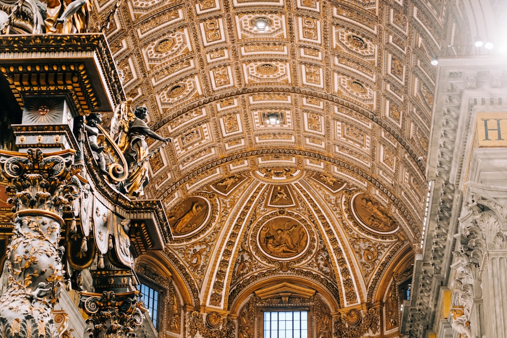 a church with a very ornate ceiling and a clock