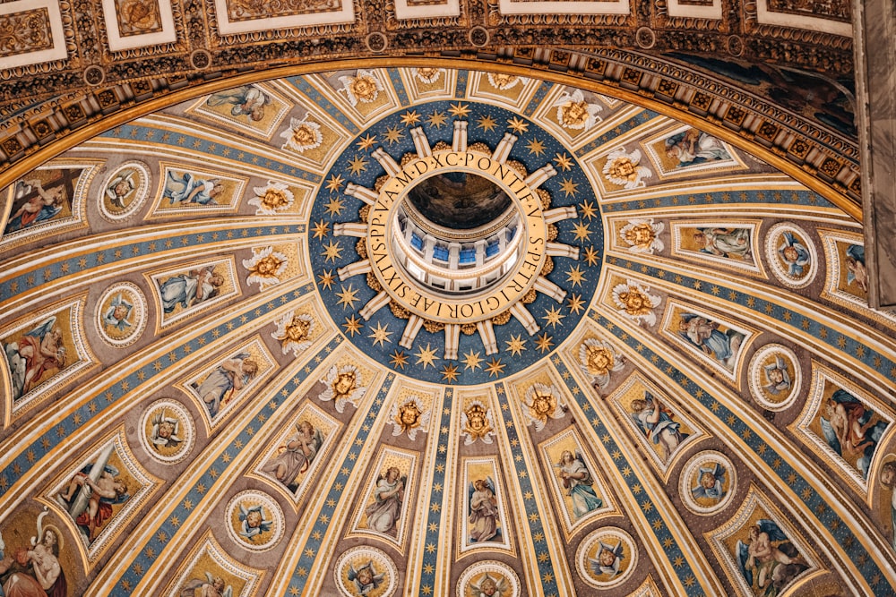 the dome of a building with paintings on it