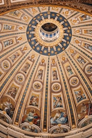 a dome with paintings on the ceiling of a building