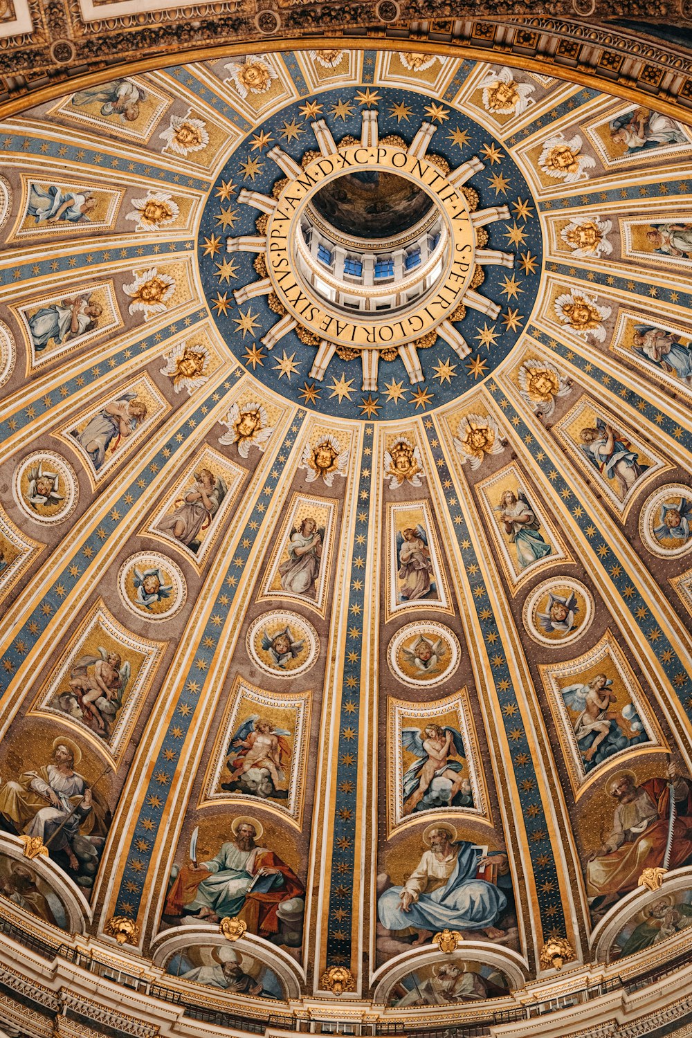 a dome with paintings on the ceiling of a building