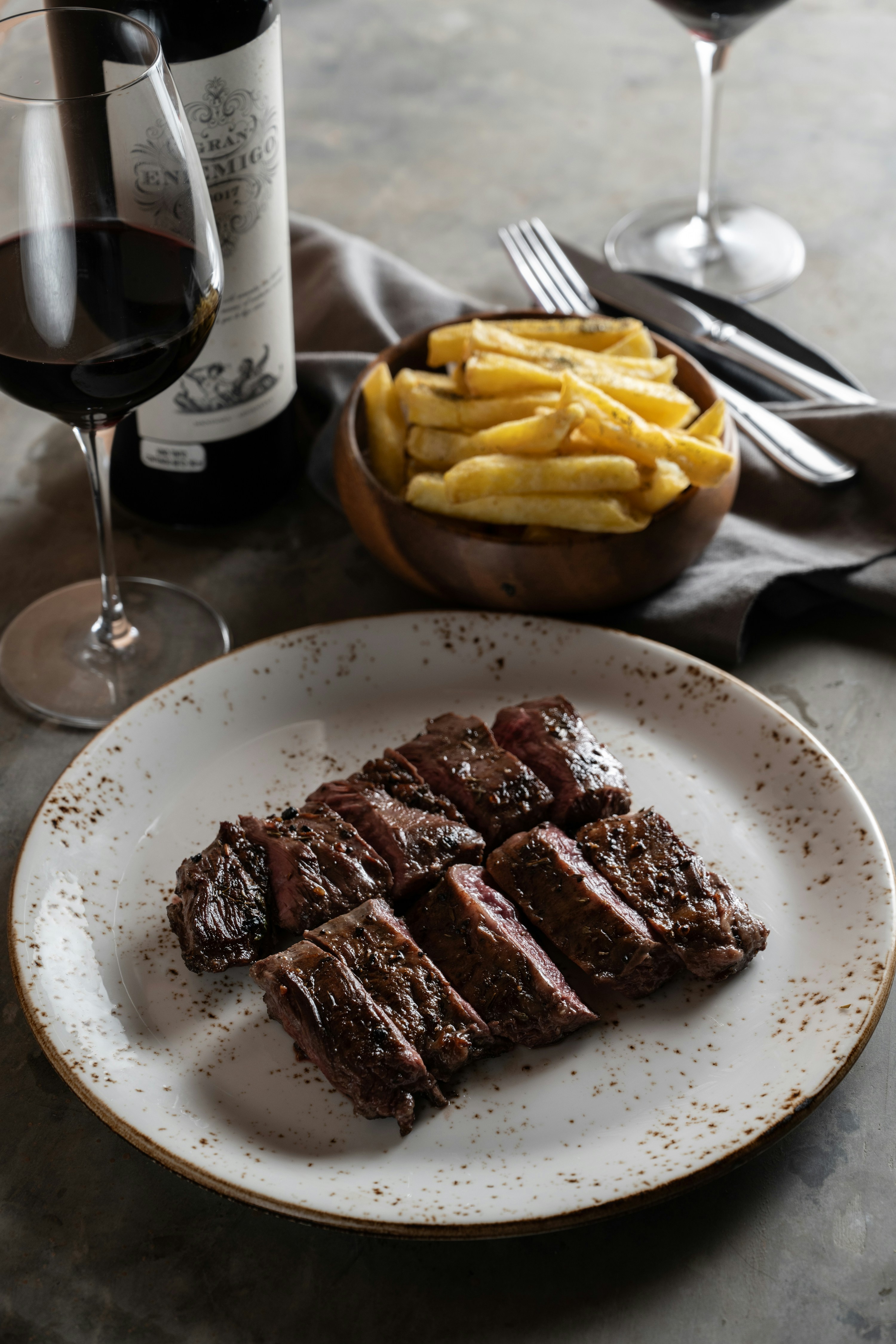 A plate of food and a glass of wine on a table photo – Free Food Image ...