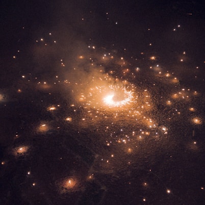 a firework is lit up in the night sky