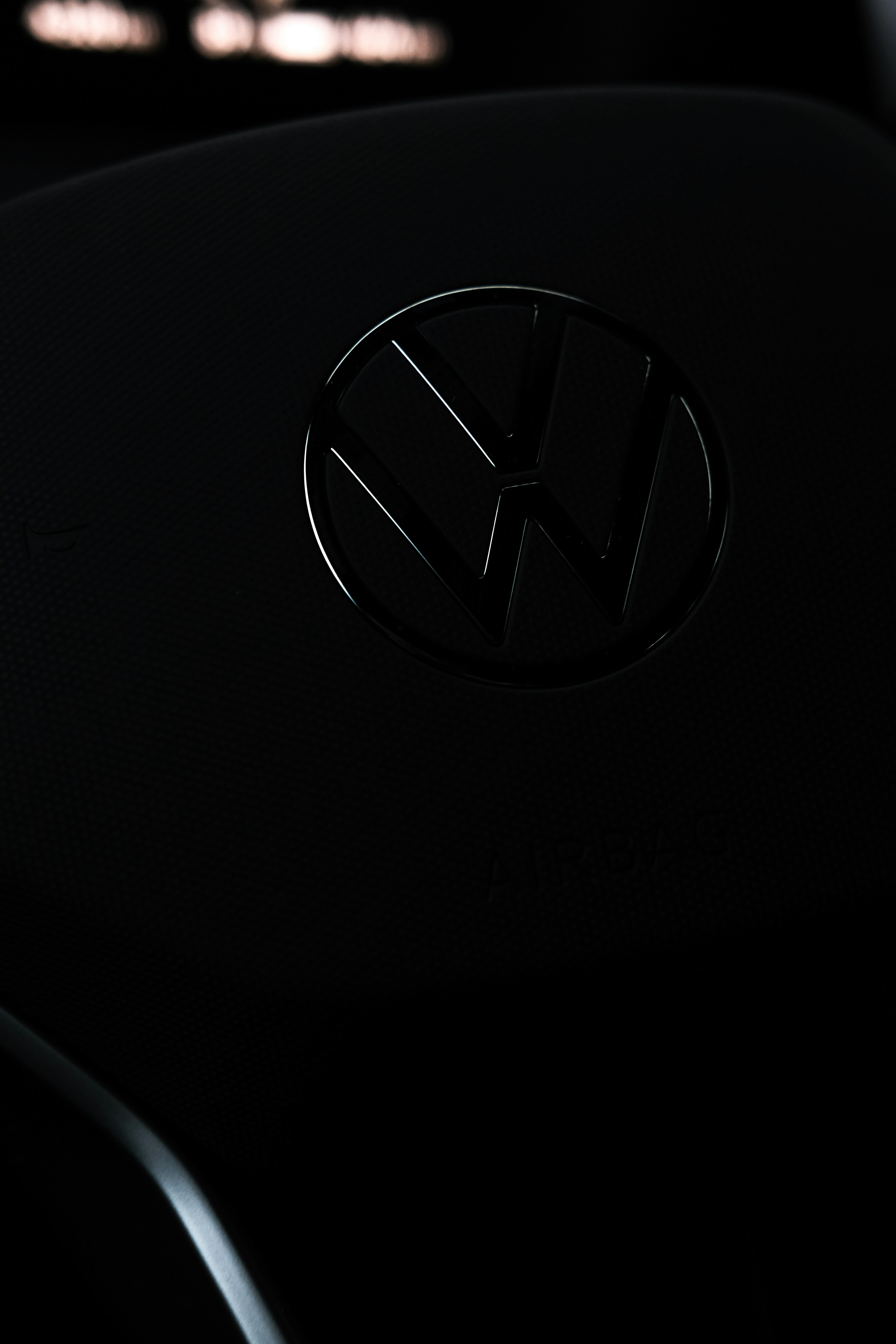 A close up of a volkswagen emblem on a car photo Free Car Image on