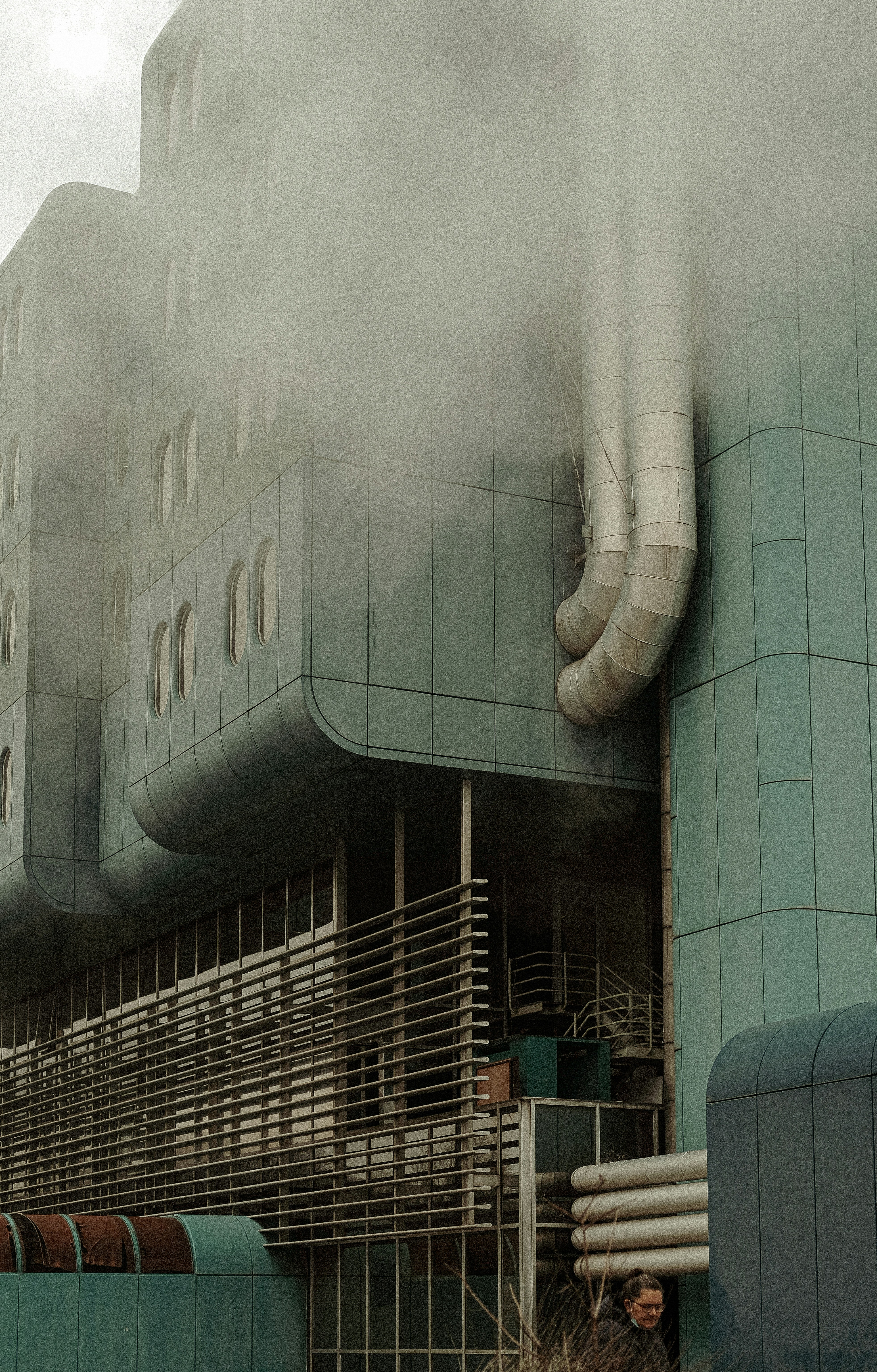smoke billows from the top of a building