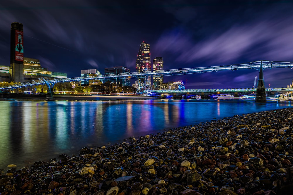 a night scene of a city and a river