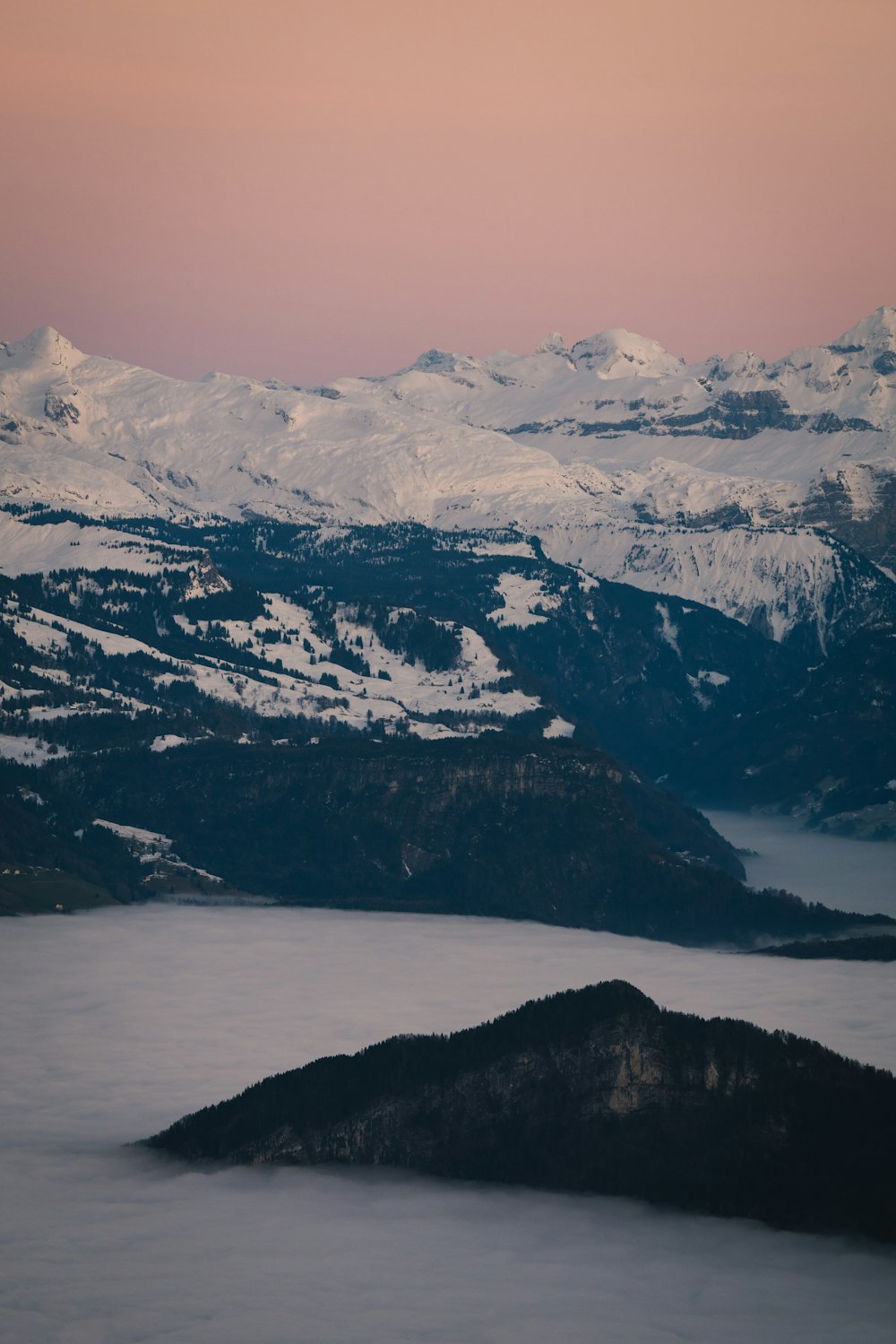 a view of a mountain range covered in snow