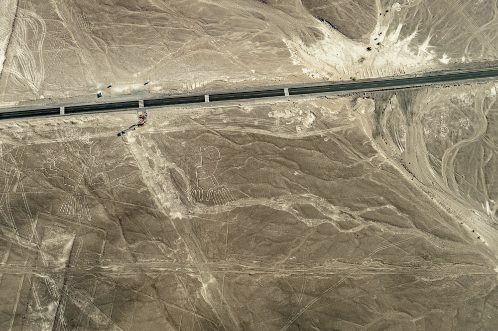 an aerial view of a highway in the desert