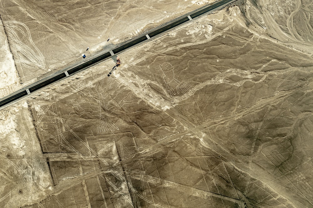 an aerial view of a highway in the desert