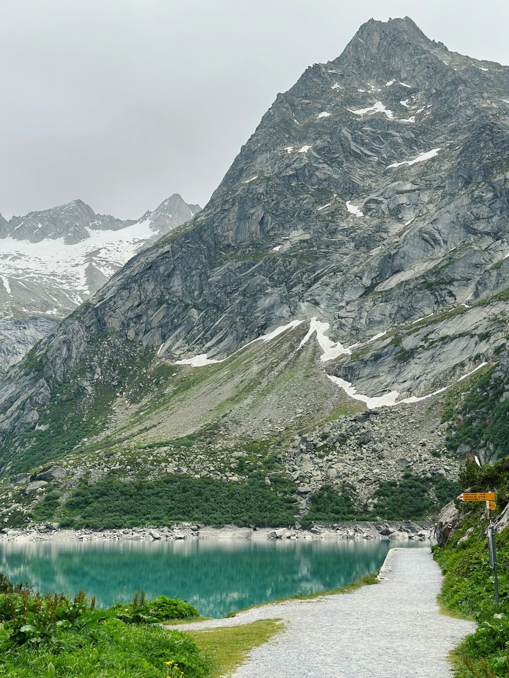 a path leading to a lake in the mountains