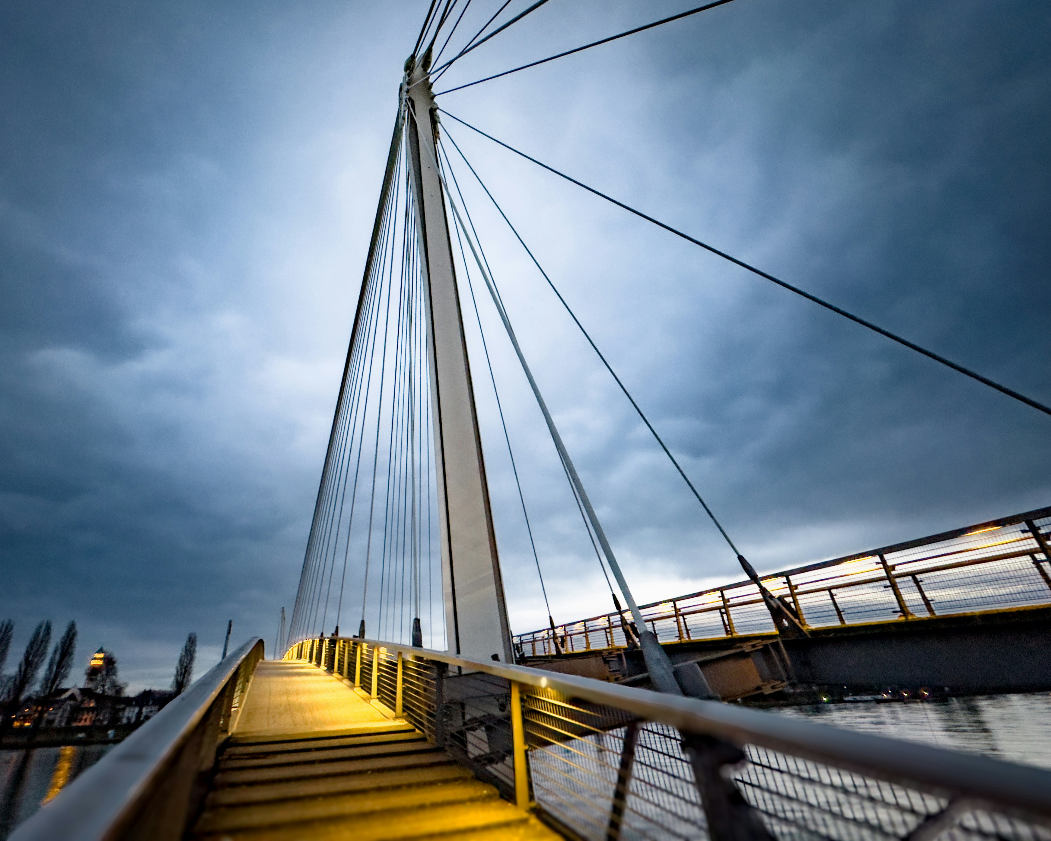 a view of the top of a bridge from the bottom of the stairs
