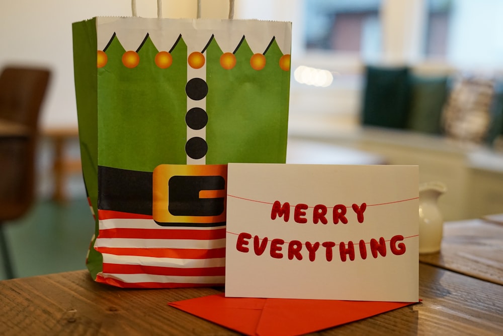 a christmas bag and a card sitting on a table