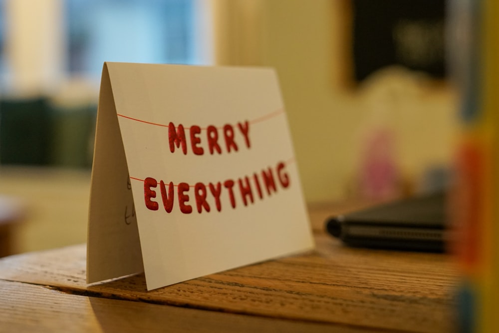 a card that says merry everything on it