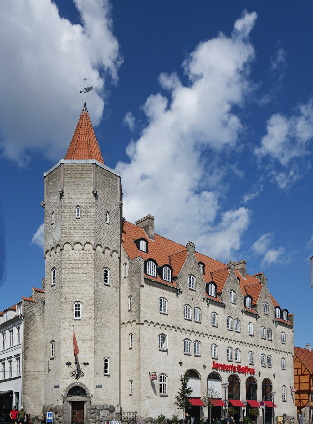 a large white building with a red roof