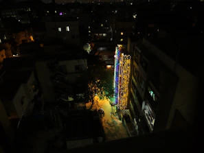 Night view of the illuminated residential blocks with navy blue and gold lighting