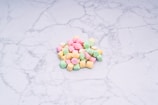 Close-up of authentic lucky charms arranged delicately on a white marble surface.