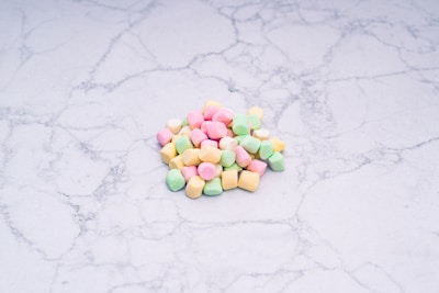 Close-up of authentic lucky charms arranged delicately on a white marble surface.