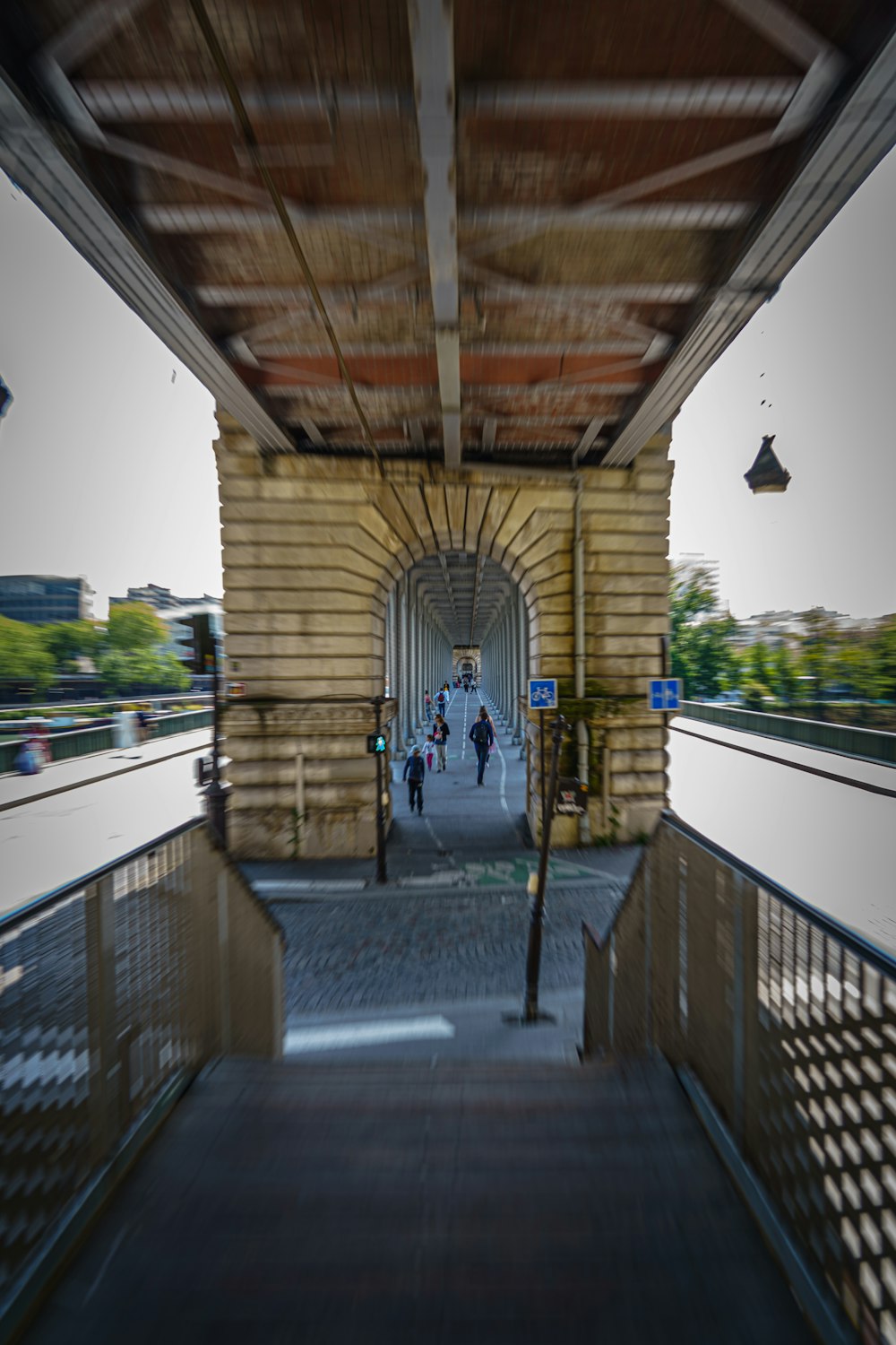 a train station with people walking on the platform