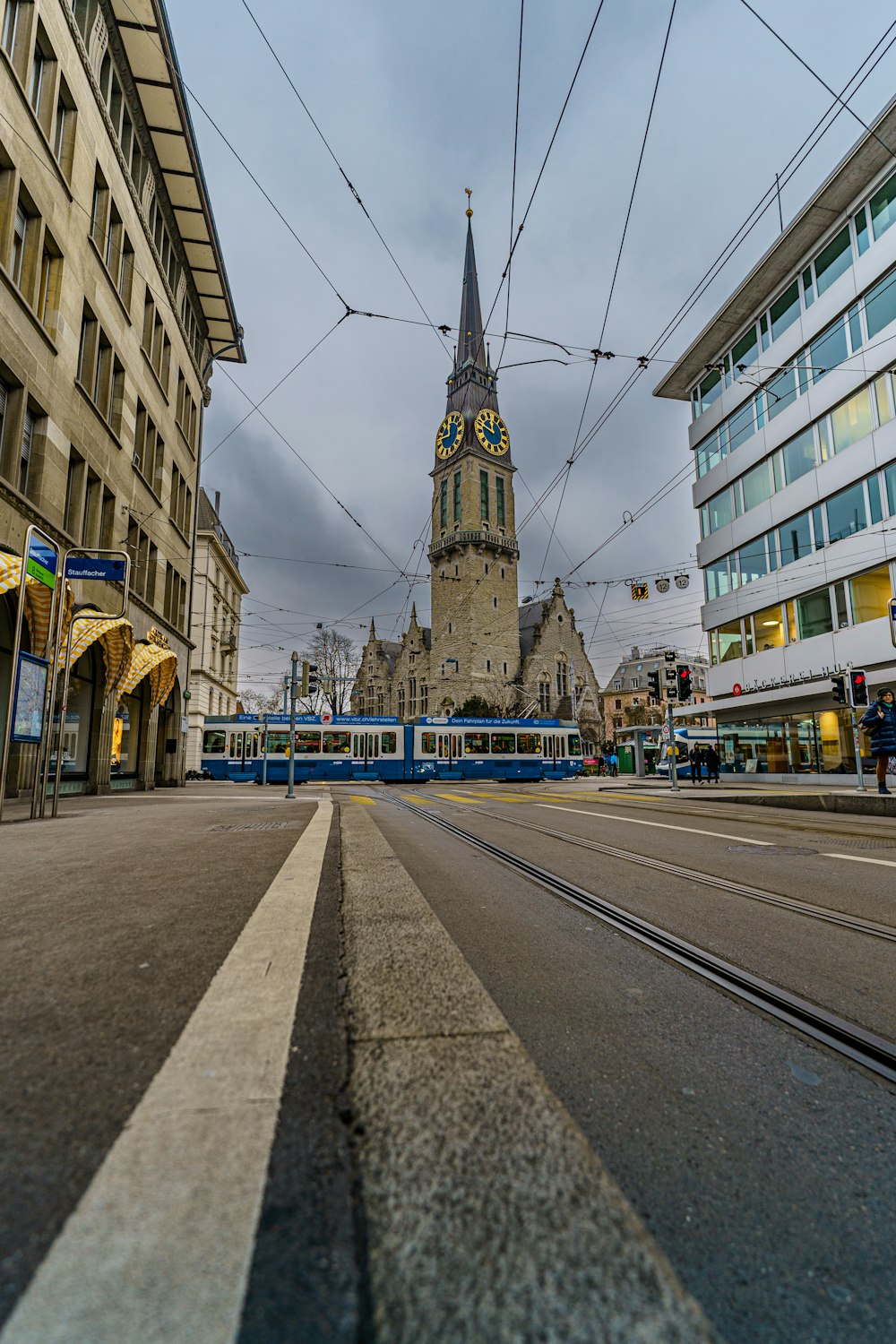 a city street with a train on the tracks