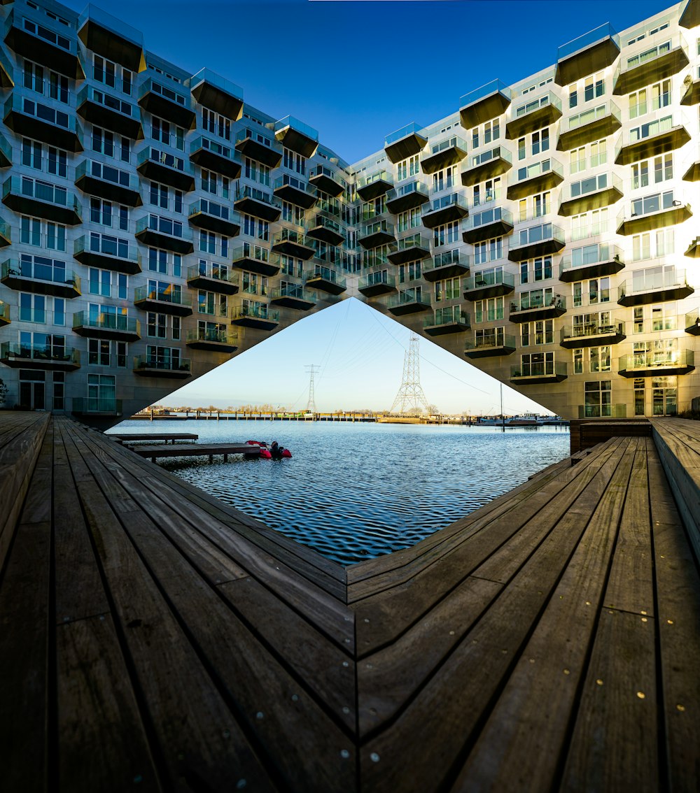 a wooden dock next to a body of water