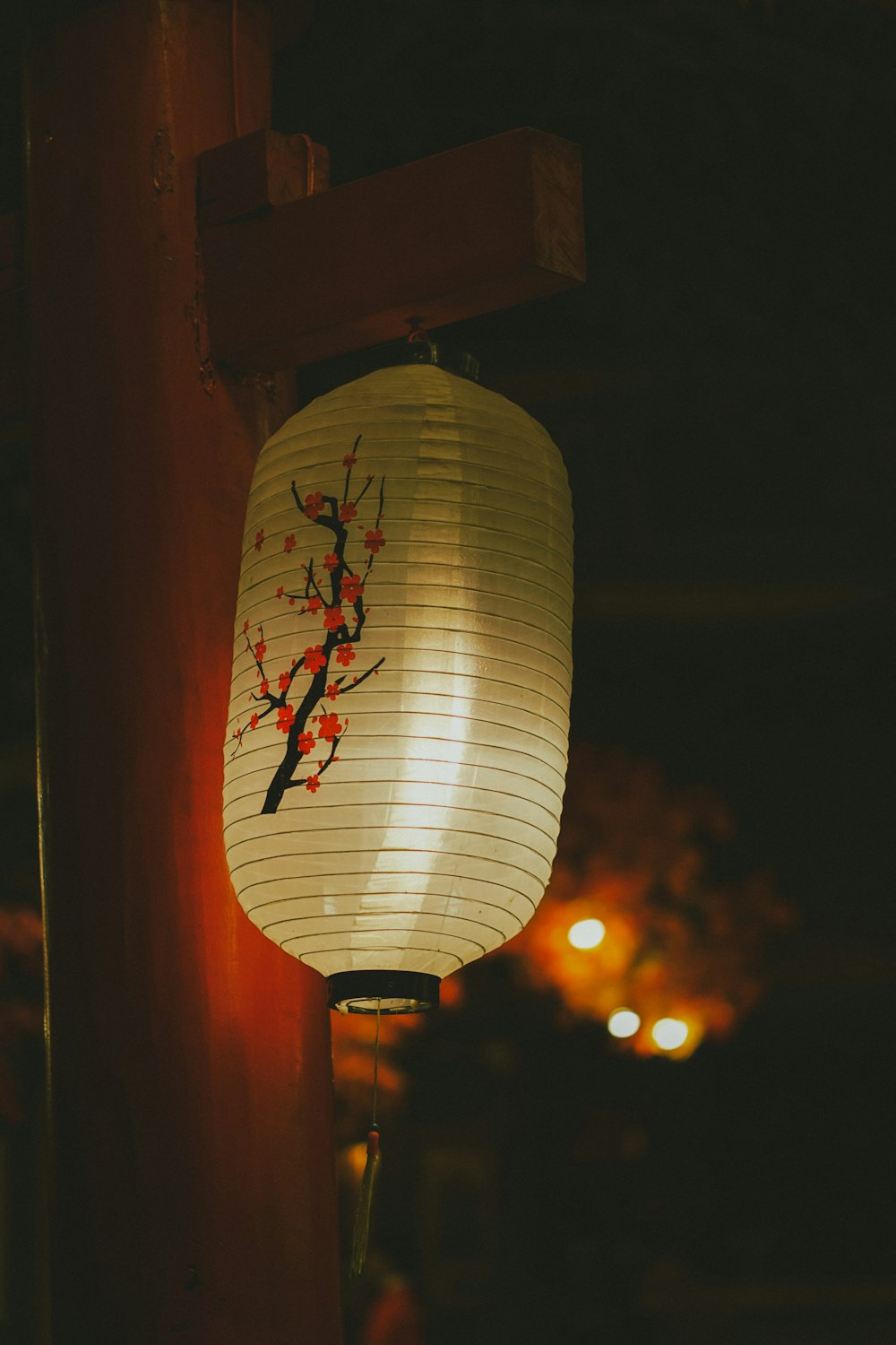 a paper lantern with a tree on it