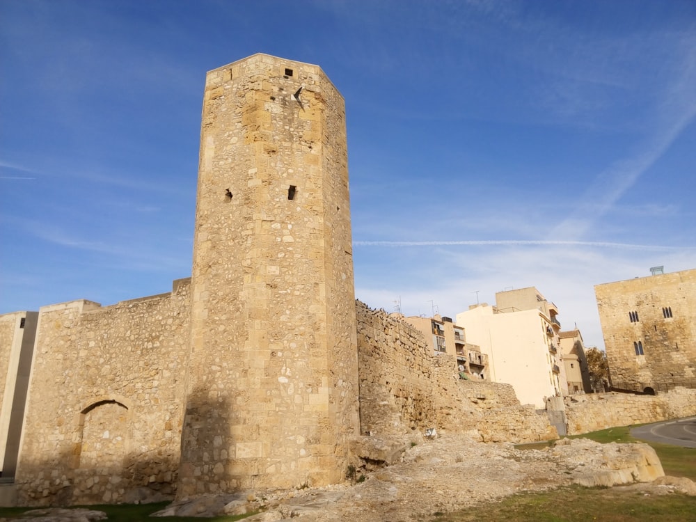 a tall tower with a clock on the top of it