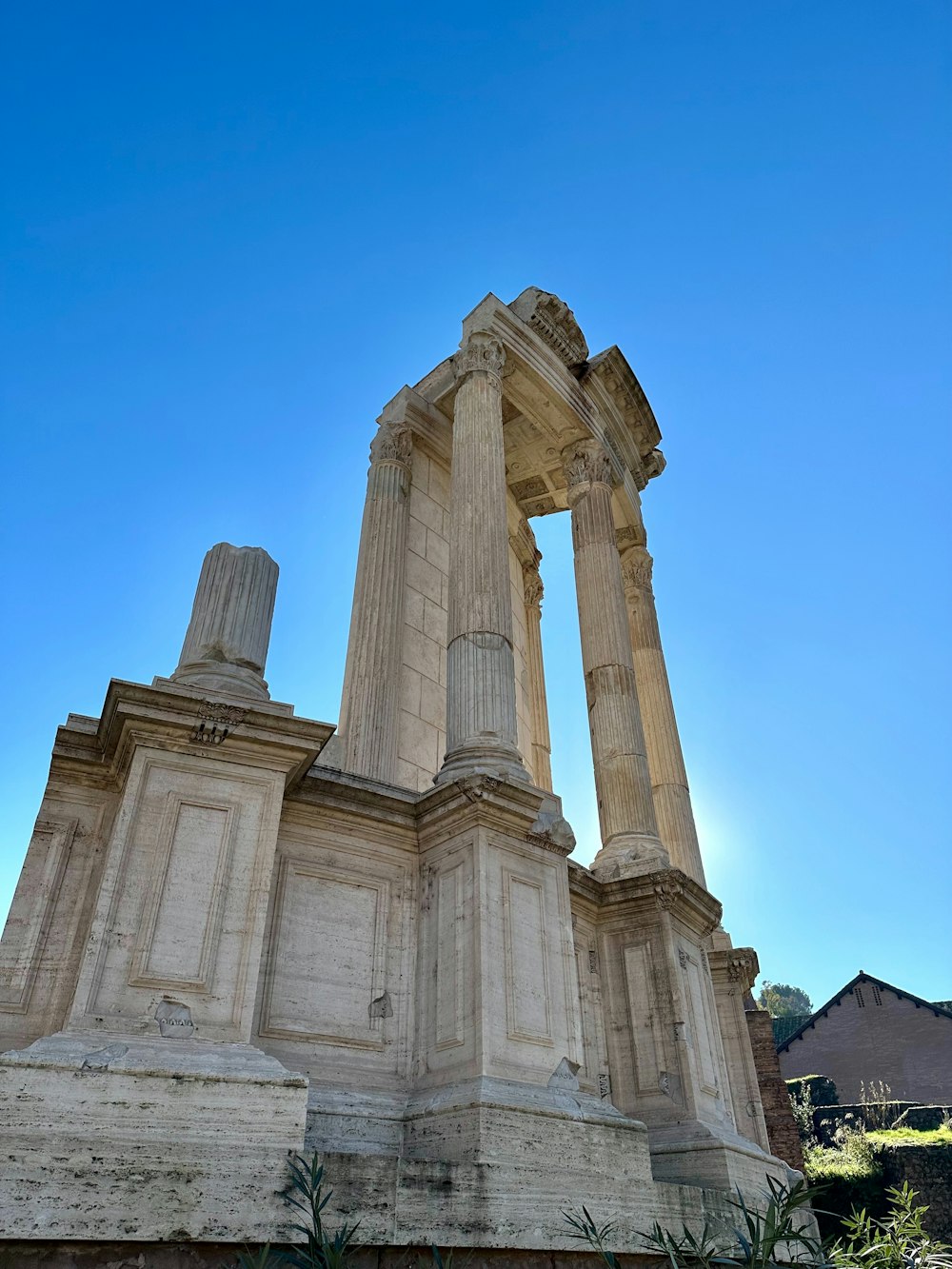 a large stone structure with two columns on top of it