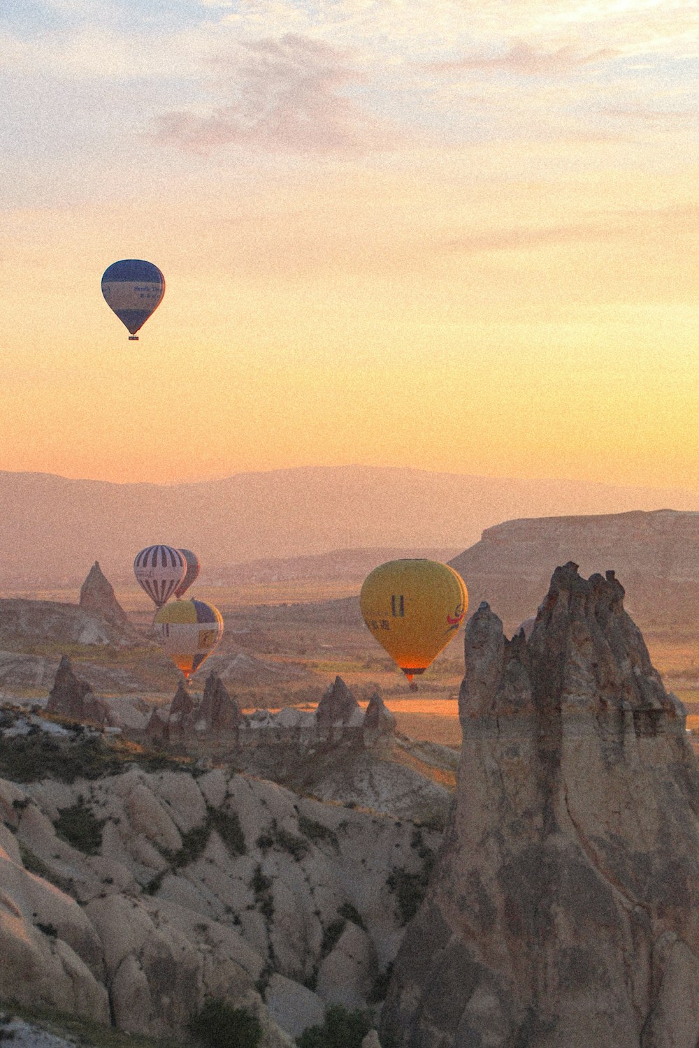 a group of hot air balloons flying in the sky